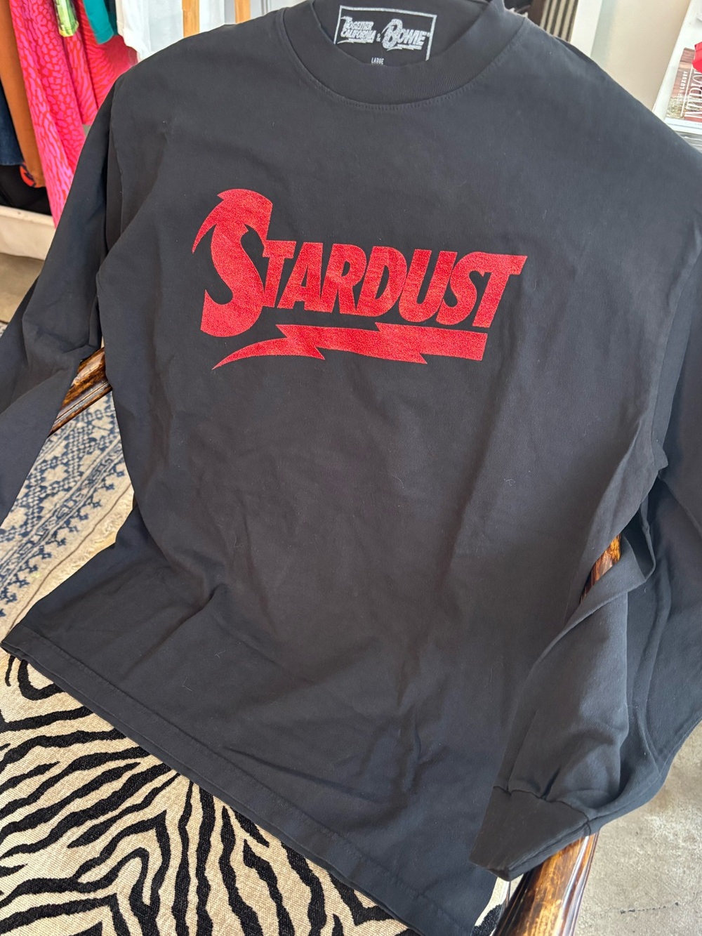 David Bowie Bold red glitter ✨ ZIGGY STARDUST logo printed on a black tee.